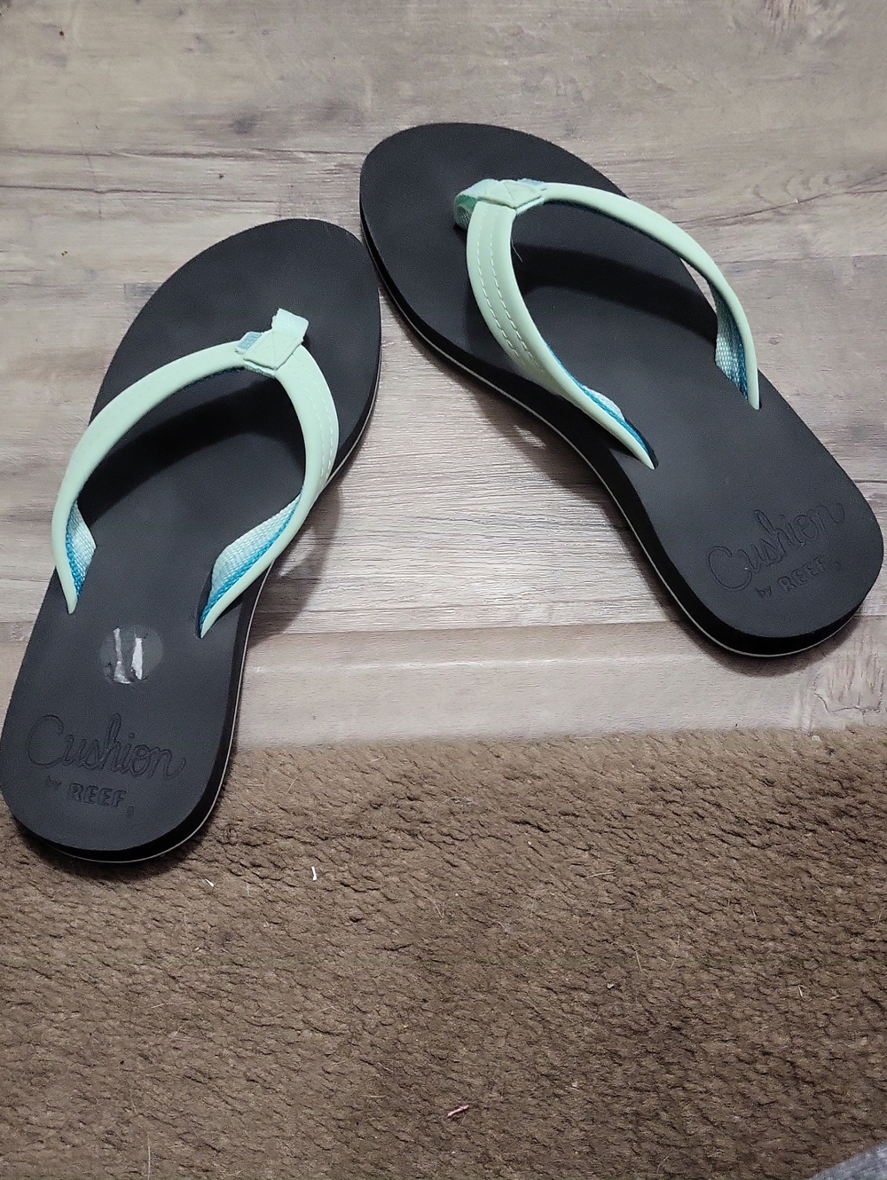 Reef Women's Black Flip Flops with Mint Straps